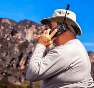 man using satellite phone