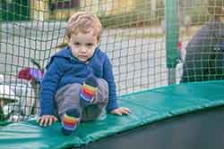 little boy getting ready to jump on trampoline