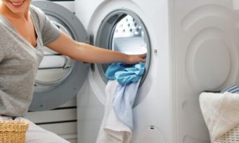 Woman using washing machine