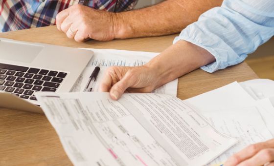 Senior couple checking their bills
