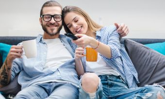 Young couple watching television