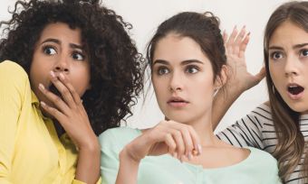 Group of young women scared while watching horror movie