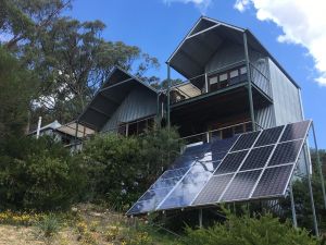 off grid house with solar panels