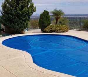 Daisy 525B Blue Solar Pool Cover on top of pool