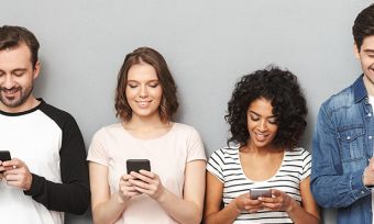 Group of people on phones. Are Telstra phones unlocked.