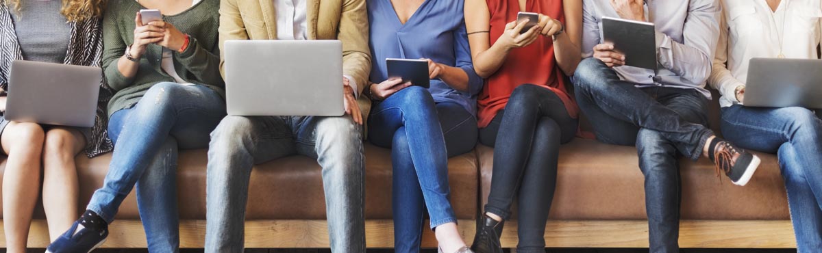 Group Of People On Laptops, Tablets And Mobile Phones