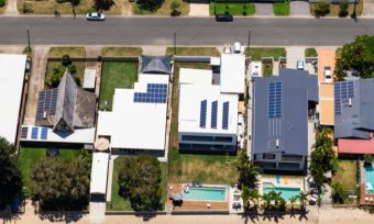 Bird's eye view of homes with solar panels