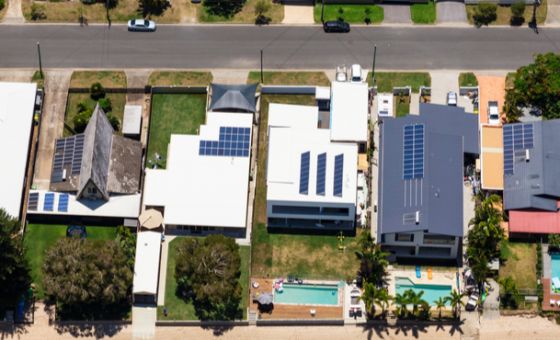 Bird's eye view of homes with solar panels