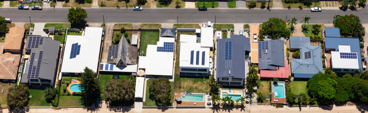 Bird's eye view of homes with solar panels