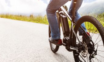 Man Riding Electric Mountain Bike In Alps