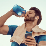 man_drinking_protein_shake_on_steps