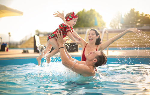 Young family in pool