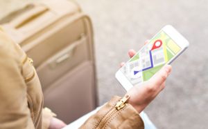 Tourist using map in phone app to navigate