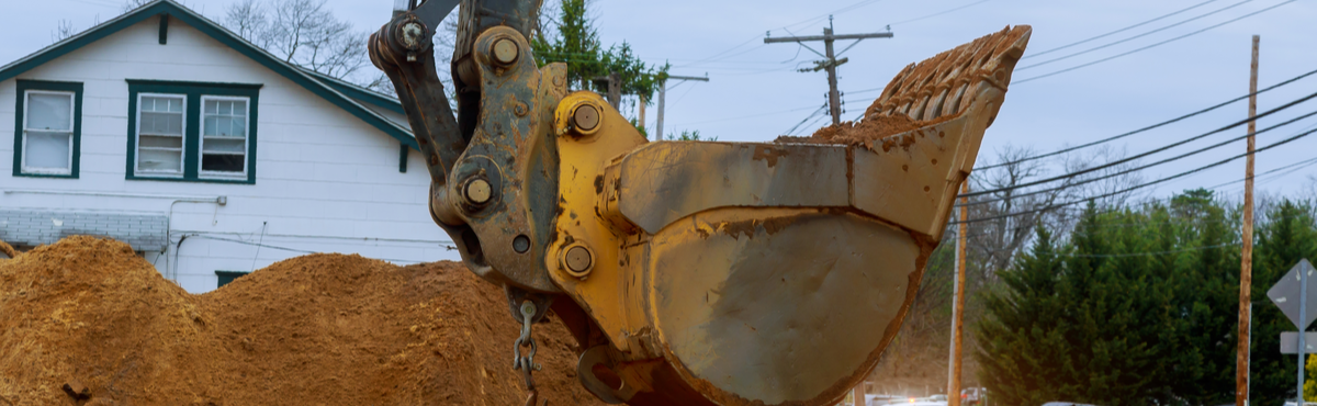 Excavator digging home