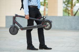 Businessman Holding Scooter