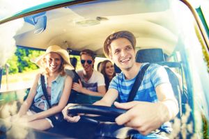 Beautiful young people on a road trip on a summers day