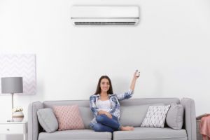 woman operating air conditioner