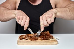 Man eating steak