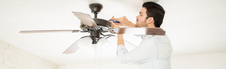 man installing ceiling fans