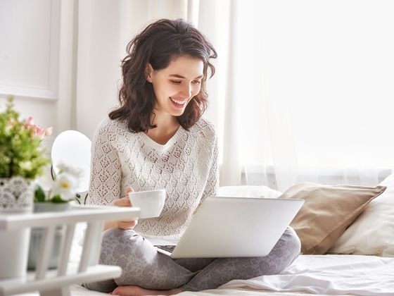 Young woman looking at laptop computer