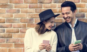 Young couple looking at phones