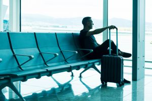 Man with luggage at airport