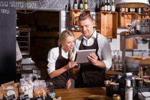 Young small business owners with laptop