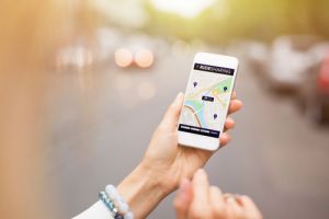 ride sharing apps holding phone