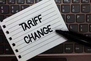 Tariff change written on note on top of keyboard