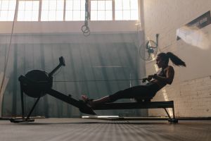 Woman exercising on rowing machine