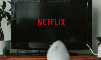 a person watching netflix on their TV