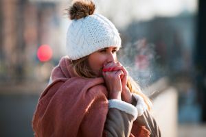 Woman warming hands