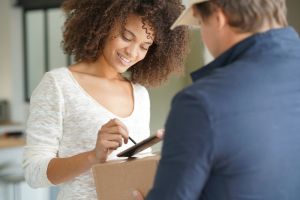 Woman signing for delivery