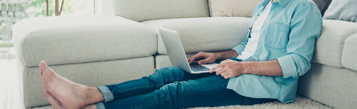 Man using laptop in elegant living room