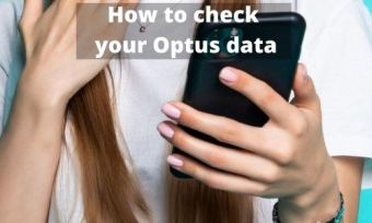 A person using a phone to check their Optus balance