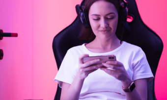 Woman playing mobile game