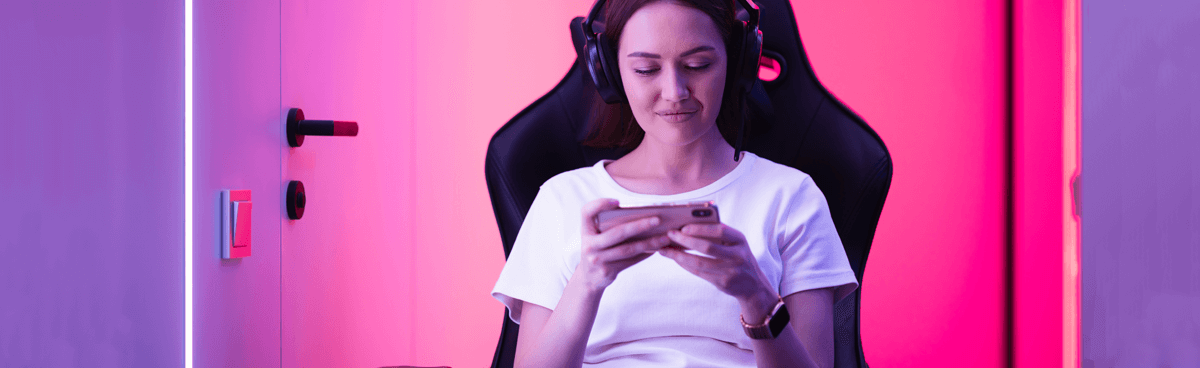 Woman playing mobile game