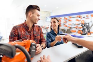 Couple buying chainsaw