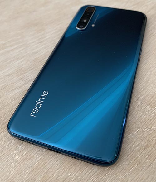 Back of the realme X3 superzoom on wood tabletop