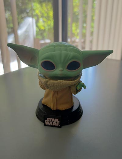 Baby Yoda figurine on tabletop