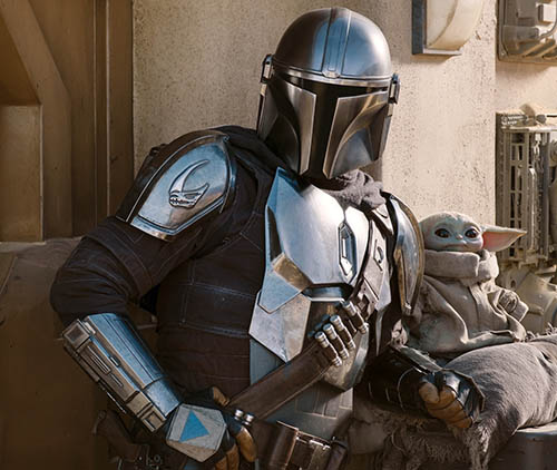 Still from season 2 of The Mandalorian with Mando and Baby Yoda
