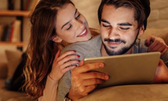 Couple watching tablet together