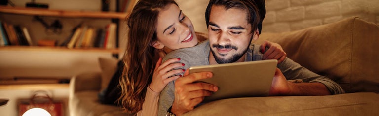 Couple watching tablet together