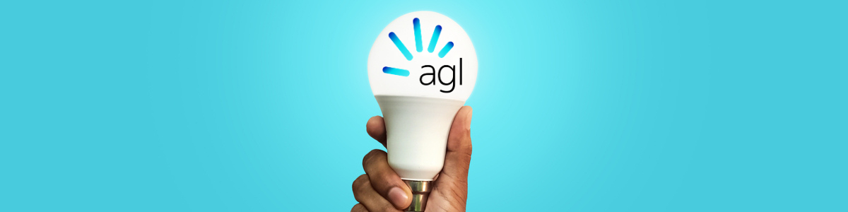 Man holding light bulb with AGL logo on blue background