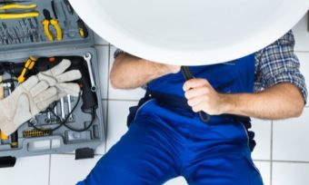 plumber fix sink blue apron