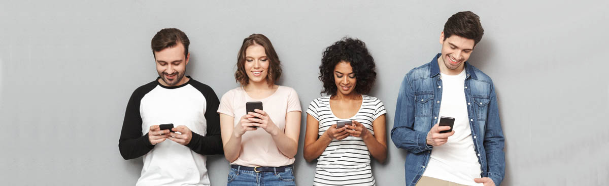 Young friend group using mobile phones