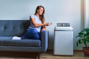 Woman sitting next to cooler on the couch