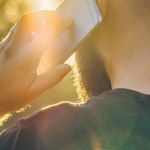 A man holding a phone to his ear