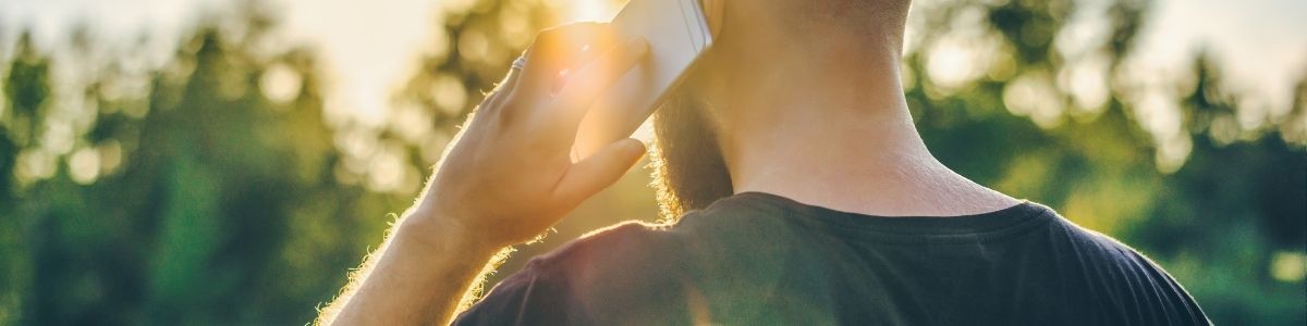 A man holding a phone to his ear