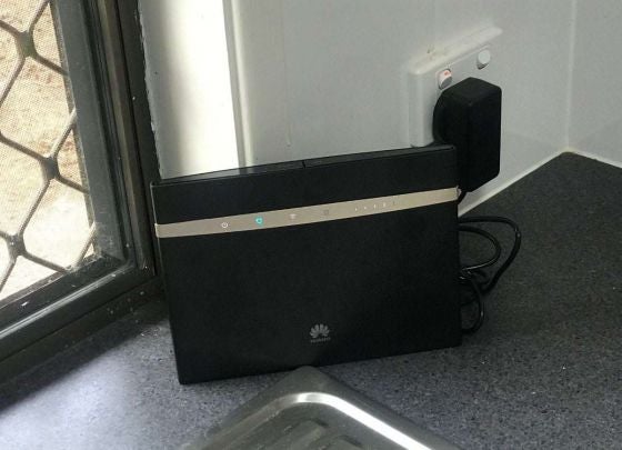 A wireless modem plugged into a wall